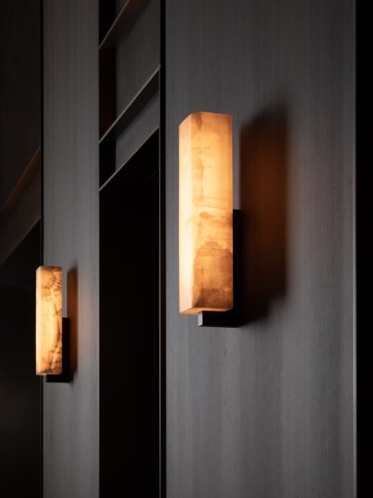 Ozone Embrun A onyx sconce with warm dimmed light